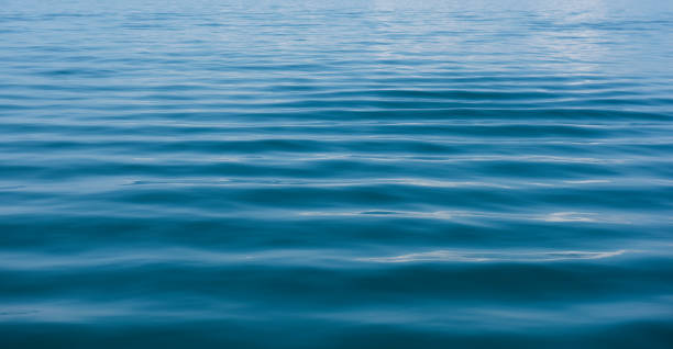 istock Blue water background with ripples Sea low angle view, Ocean, Wave.   Travel destination and nature environment concept - Ocean water surface texture, summer holiday background 1206973718