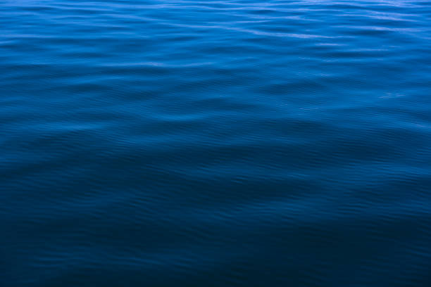 istock Blue water background with ripples Sea low angle view, Ocean, Wave.   Travel destination and nature environment concept - Ocean water surface texture, summer holiday background 1206973719