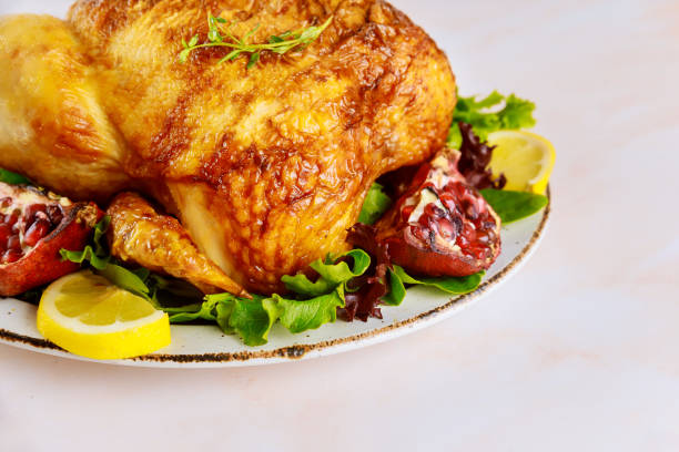 istock Roasted turkey on plate with herbs and pomegranate. 1206976098