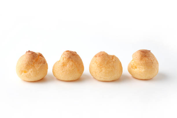cream puffs aligned closeup isolated on white background