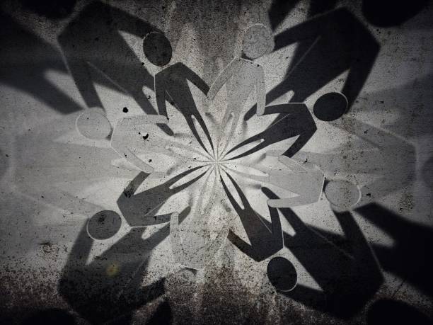 Abstract people silhouettes emerging on old concrete wall