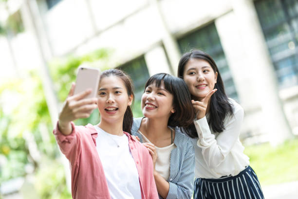 Three young girls in the park stock photo