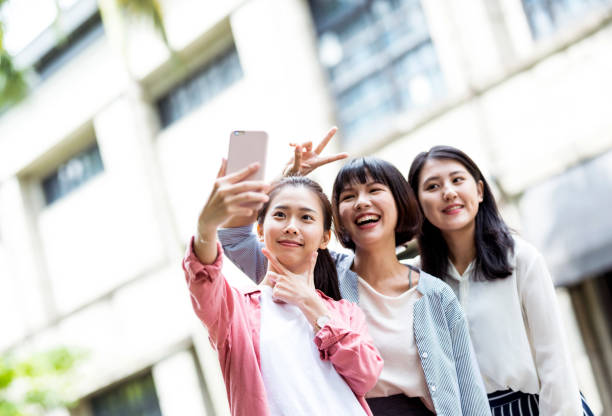 istock Three young girls in the park 1206979994