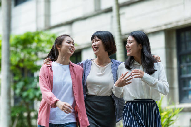istock Three young girls in the park 1206980052