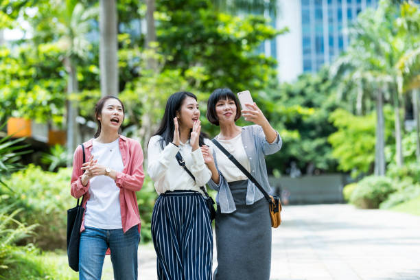istock Three young girls in the park 1206980064