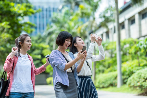 istock Three young girls in the park 1206980066