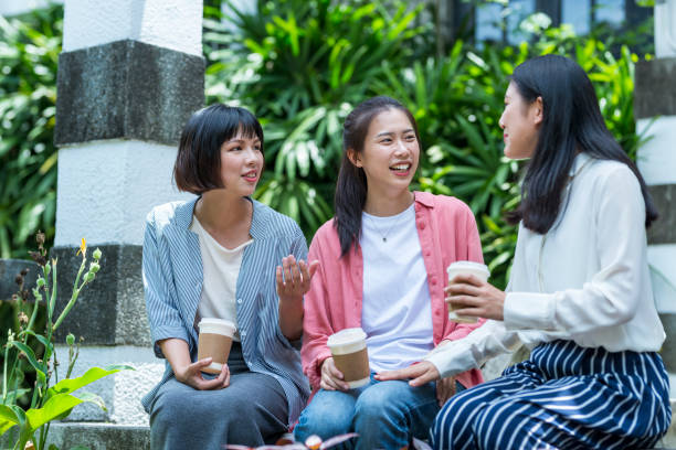 istock Three young girls in the park 1206980122