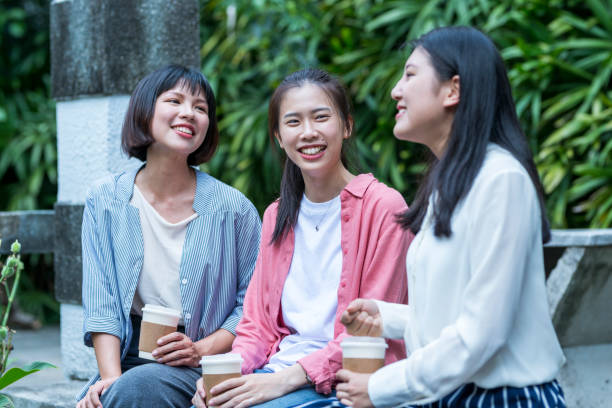 istock Three young girls in the park 1206980125