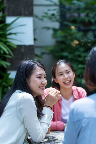istock Three young girls in the park 1206980146
