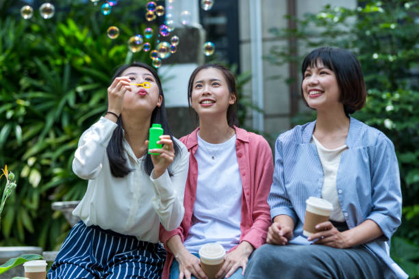 istock Three young girls in the park 1206980179