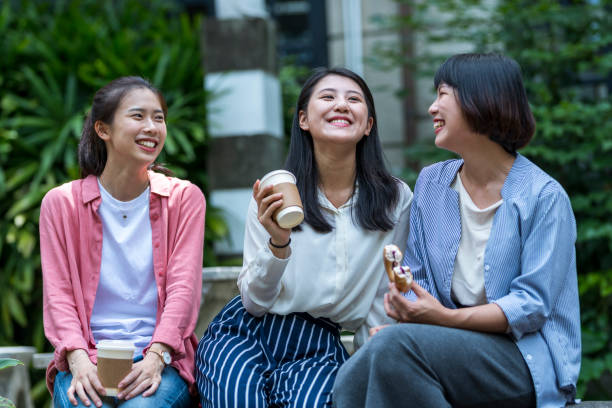 istock Three young girls in the park 1206980186