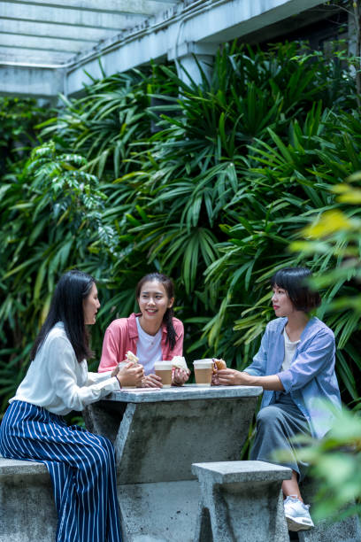 istock Three young girls in the park 1206980196