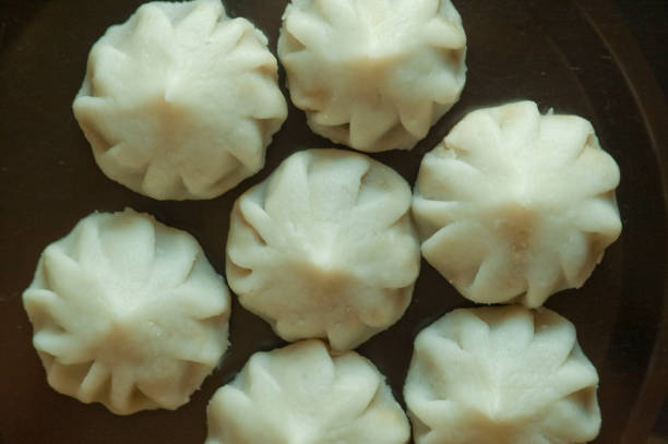 Chinese handmade dumplings neatly arranged on table. Traditional food. Ready to cook and serve.