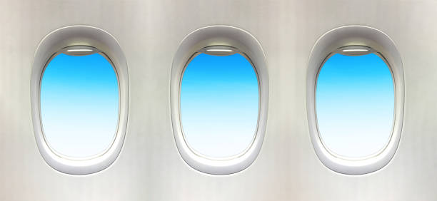 istock Airplane window and Fantastic soft white clouds against blue sky. 3 plane window 1206985431