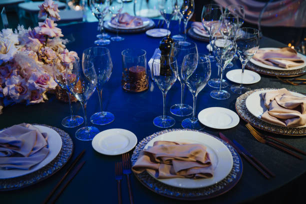 istock Glasses, forks, knives, plates on a table in restaurant served for dinner 1206987472