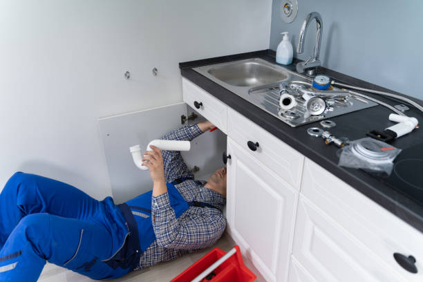 istock Male Plumber In Overall Fixing Sink Pipe 1206990022