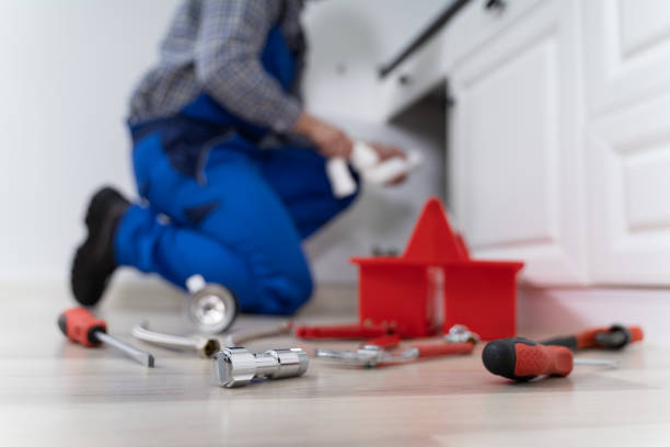 istock Male Plumber In Overall Fixing Sink Pipe 1206990026