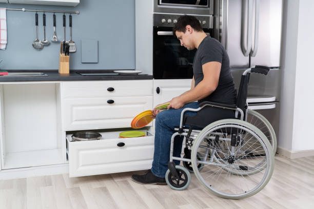 istock Disabled Man Sitting On Wheelchair Arranging Plates 1206990116