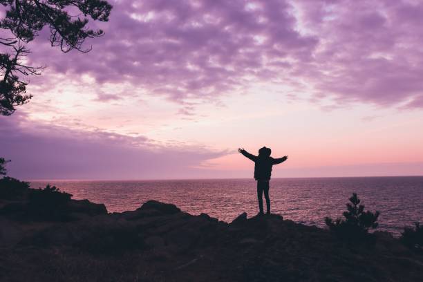istock Young man rise hand and Refresh at the mountain 1206990125