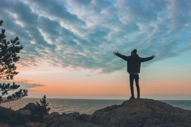 istock Young man rise hand and Refresh at the mountain 1206990131