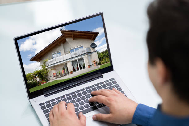 istock Selecting New House On Laptop 1206990249