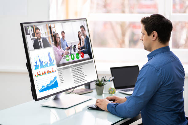 istock Businessman Video Conferencing With Team 1206990271