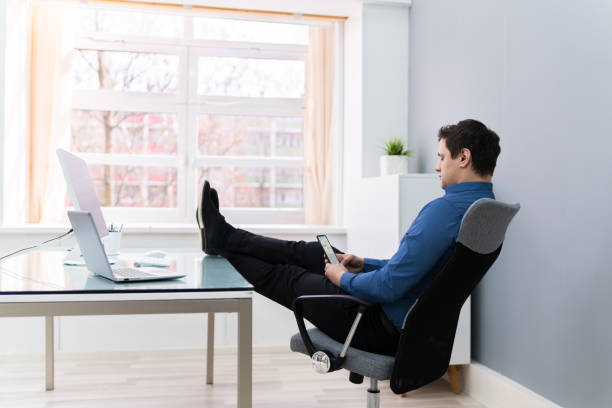 istock Businessman Relaxing On Chair 1206990301