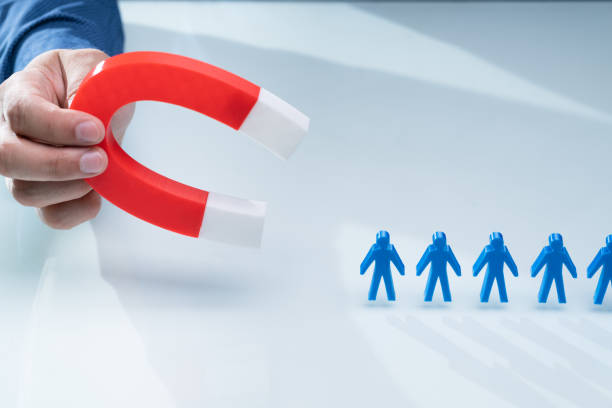 istock Businessman Attracting Blue Team With Horseshoe Magnet 1206990341