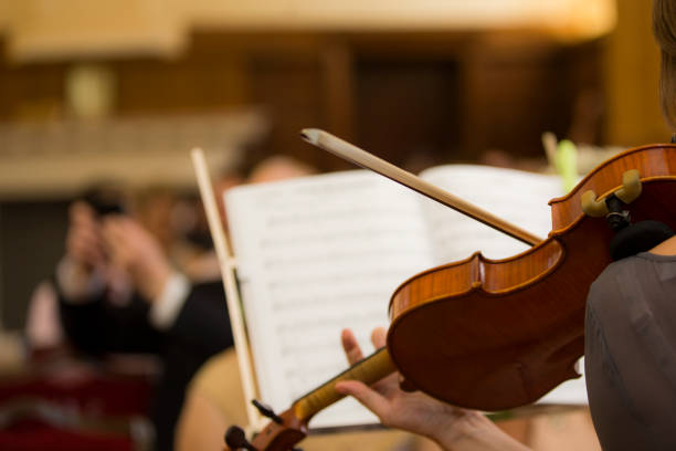 istock Violinist playing at a wedding orchestra in church 1206991697