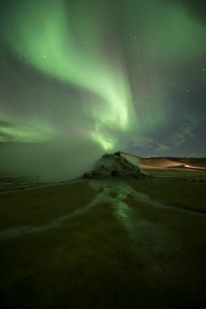 istock Aurora Borealis (Northern Lights) above geothermal volcanic vents in Hveravellir 1206991748