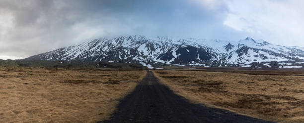 istock Long road heading to mountains 1206991759