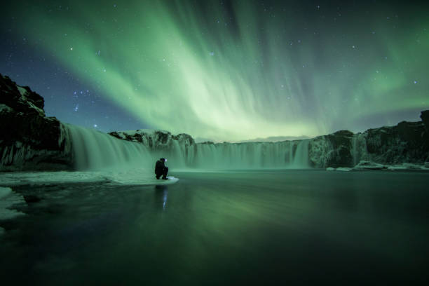 istock Northern Lights (Aurora Borealis) above Godafoss Waterfall, Iceland 1206991794
