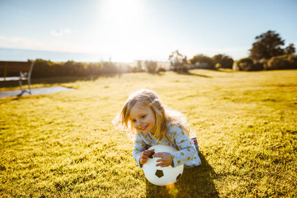 istock happiness children lyind down in the grass 1206991882