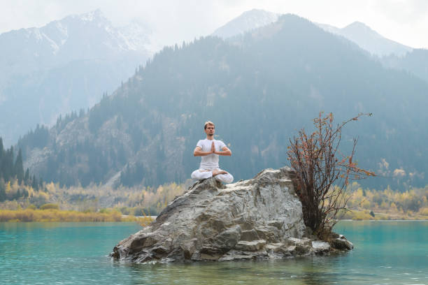 istock A young man practices yoga. Exercise Agni Stambhasana. 1206992970