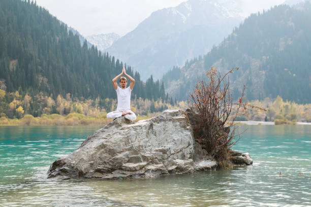istock A young man practices yoga. Exercise Agni Stambhasana. 1206993064