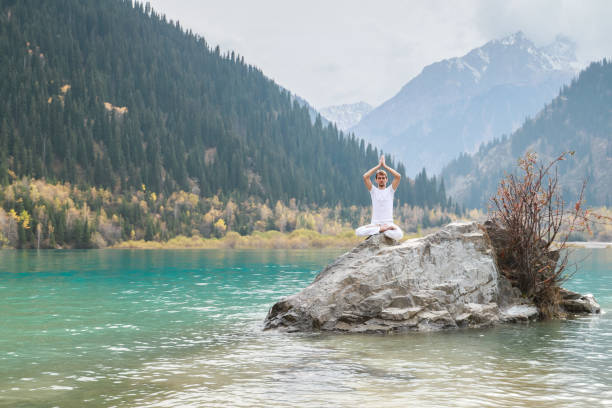 istock A young man practices yoga. Exercise Agni Stambhasana. 1206993071