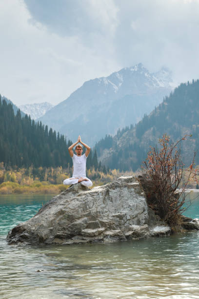 istock A young man practices yoga. Exercise Agni Stambhasana. 1206993589