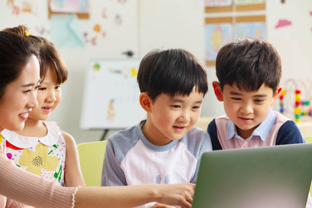 istock The kindergarten children watch video 1206995990