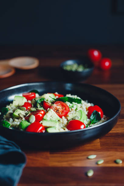 istock Healthy salad with bulgur, avocado, spinach and cherry tomatoes. 1206996351