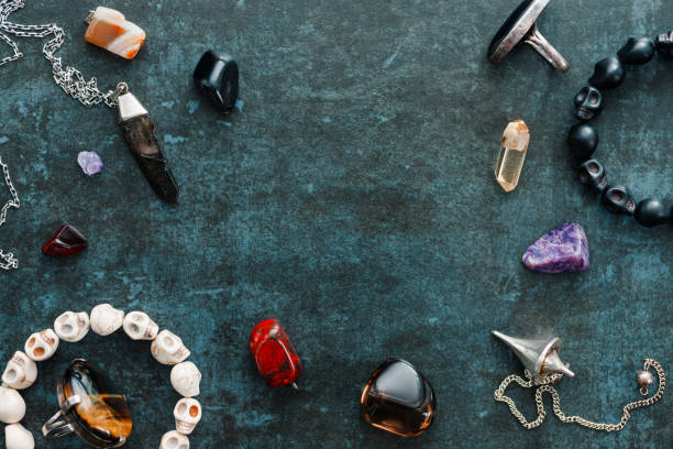 istock Magic flat lay. Various precious and semiprecious stones on a blue background for witchcraft. 1206996367