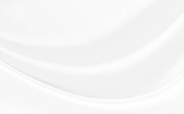 istock White gray satin texture that is white silver fabric silk background with beautiful soft blur pattern natural. 1206997600