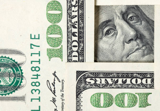 Square made of $100 bills with Benjamin Franklin inside stock photo