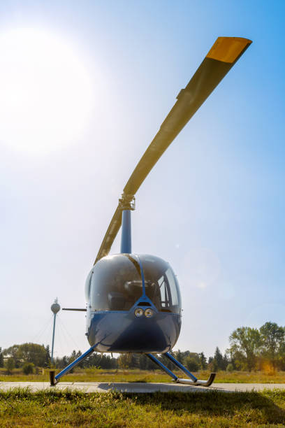 istock Helicopter standing on helipad on a sunny day 1206998742