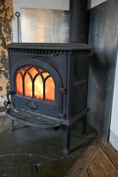 istock indoor fire in a cast iron stove 1206999674