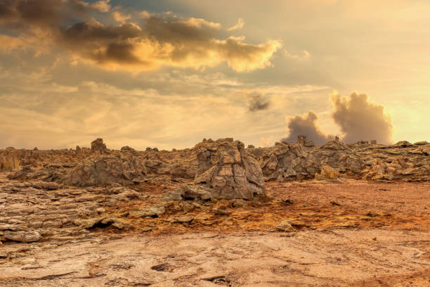 abstract landscape in Dallol, Danakil depression, Ethiopia abstract apocalyptic incredible landscape of Dallol desert situated in the Afar Triangle, land like moonscape. Hottest place on Earth with non realistic sky. dallol ethiopia stock pictures, royalty-free photos & images