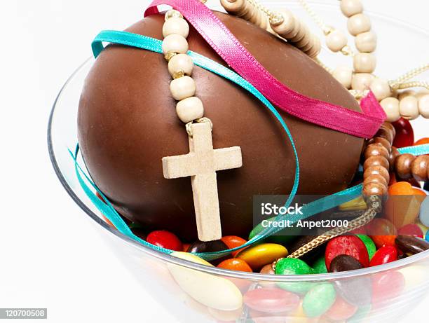 Easter Chocolate Egg Sweets And Cross In A Glass Stock Photo - Download Image Now - Bowl, Brown, Candy