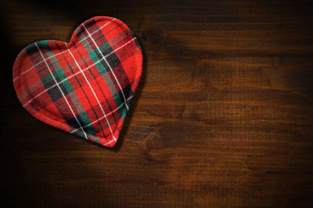 istock Fabric heart shape on a wooden background 1207008250