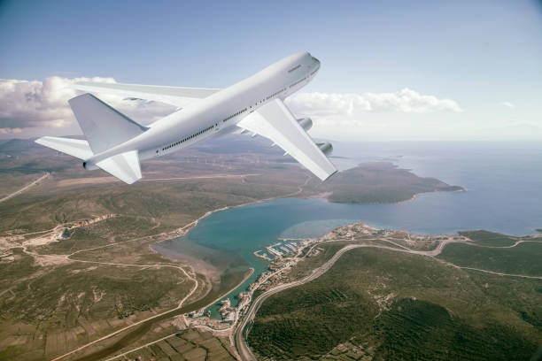 istock passenger plane flight take off over a coast city 1207009409