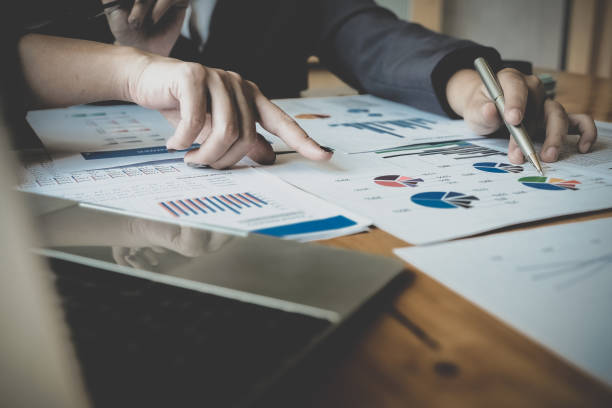 istock Business People Planning Strategy Analysis from financial document report, Office Concept - Vintage tone 1207009715