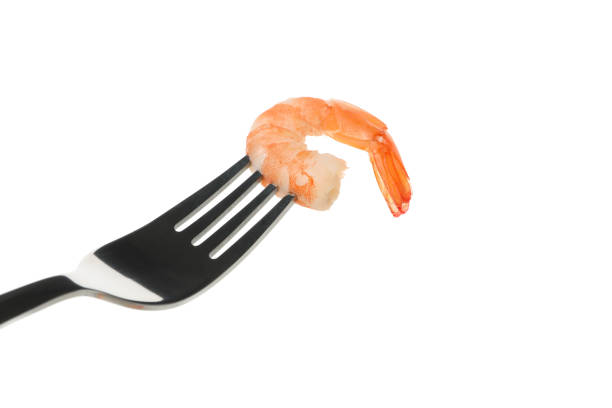istock Fork with shrimps isolated on white background 1207009851